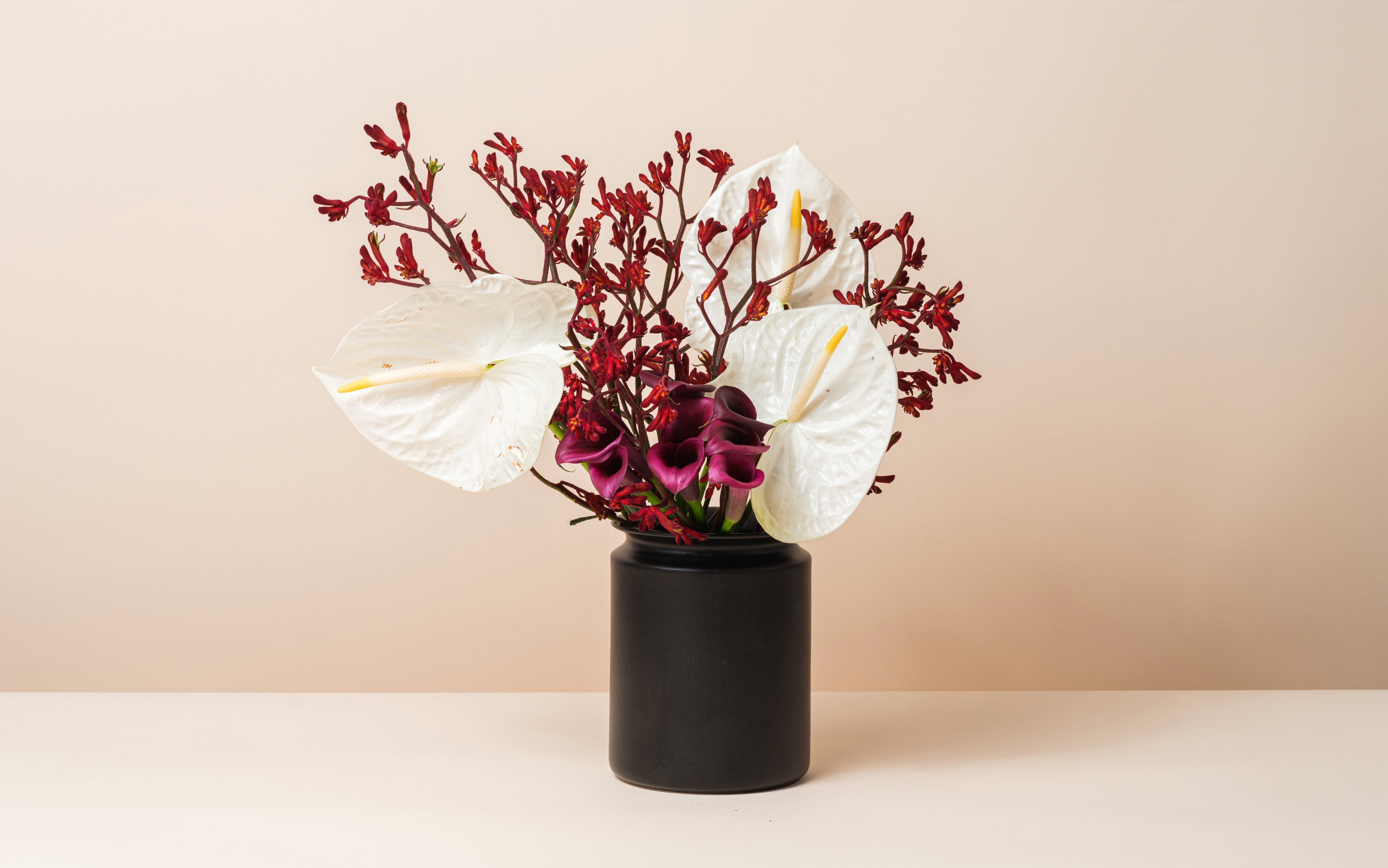 Retrospect by MERIT in a black vase