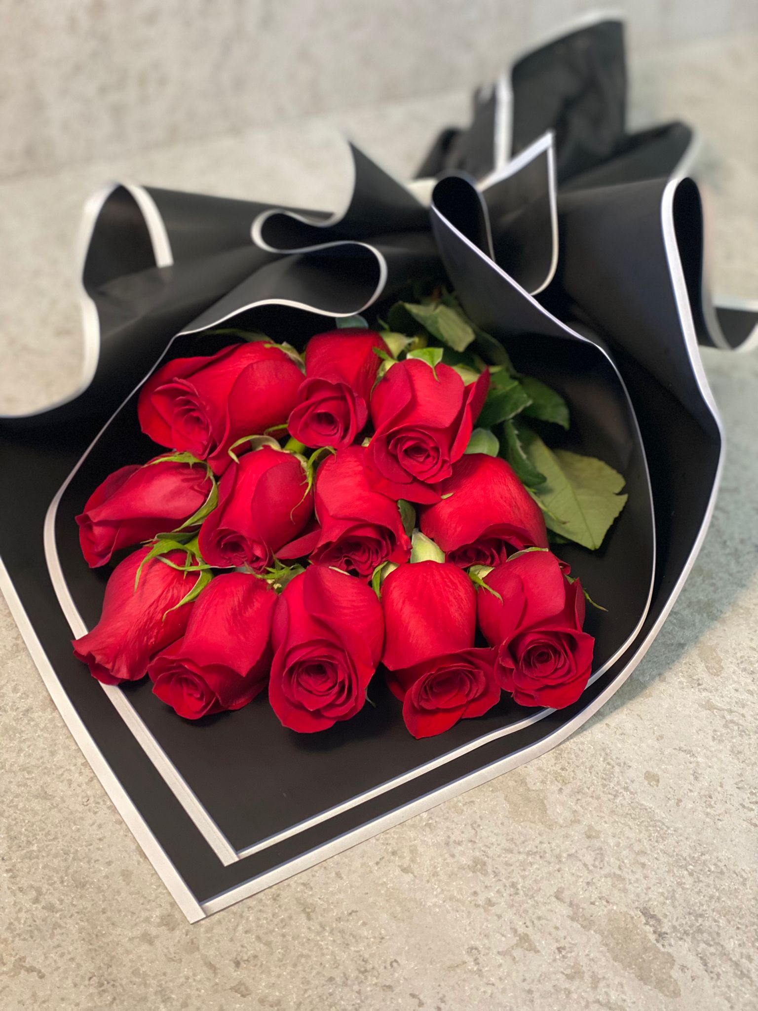 Dozen red roses wrapp